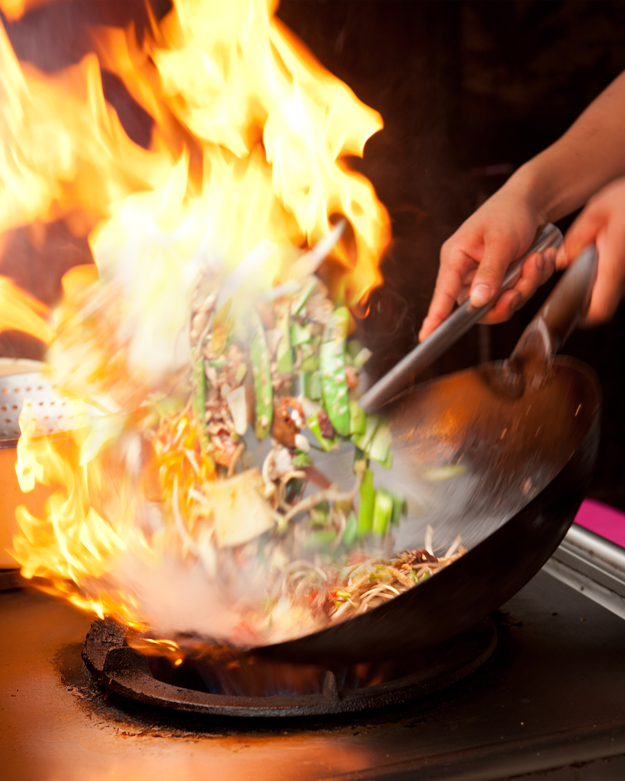 Wok frying with flames